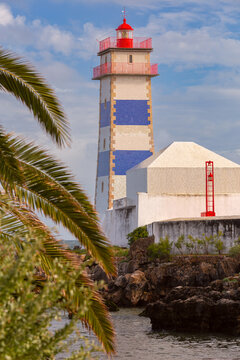 Santa Marta Lighthouse and Rocky Coastline in Cascais, Portugal