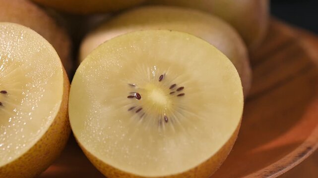 Fresh Yellow Kiwifruit in Wooden Bowl