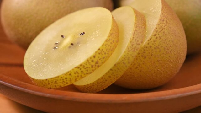 Fresh Yellow Kiwifruit in Wooden Bowl