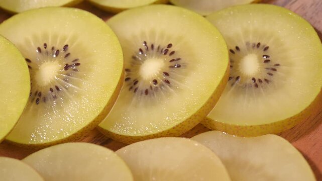 Fresh Yellow Kiwifruit in Wooden Bowl