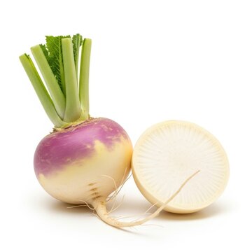 Whole and halved fresh turnip vegetable with green leaves and roots isolated on white background