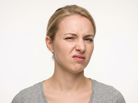 Close-Up of Young Woman with a Disgusted and Repulsed Facial Expression