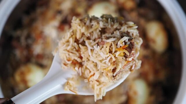 Cooking biryani at home with friends in the kitchen