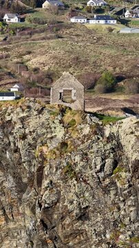 Aerial view of the remaining wall of the old coastguard station in Teelin, County Donegal, Ireland