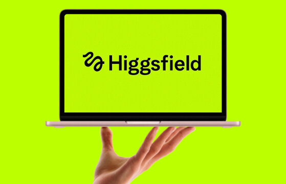 Higgsfield Logo Displayed on Pink MacBook Screen Balanced on Open Hand Against Yellow Green Background