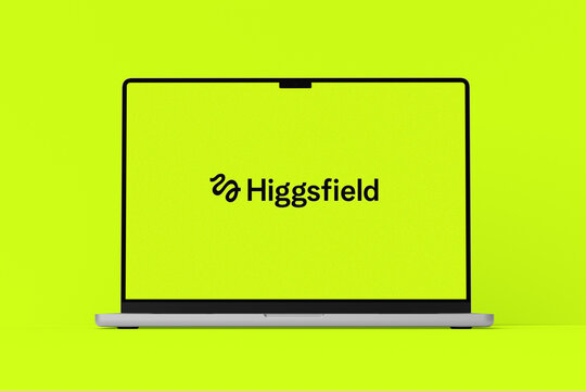 Higgsfield Logo Displayed on MacBook Screen Isolated Against Bright Yellow Green Background