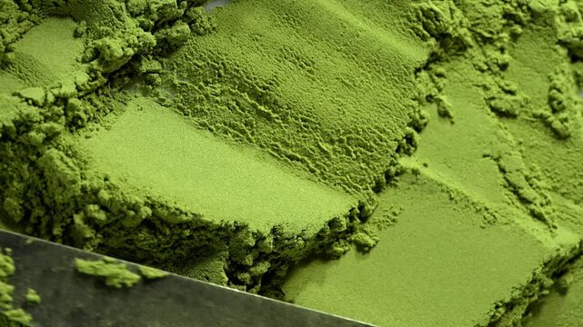 Matcha green tea powder close up, dry green powder texture, detox superfood concept, healthy lifestyle. Moringa, Spirulina, chlorella superfoods
