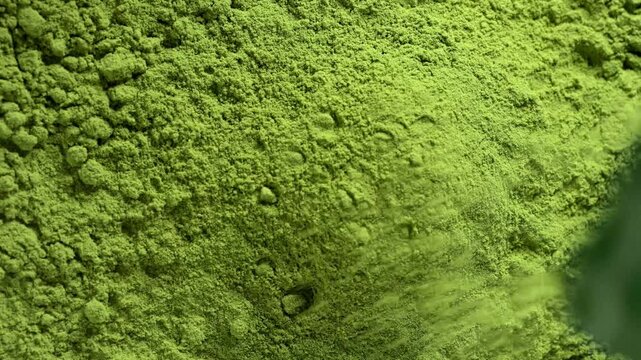 Matcha green tea powder close up, dry green powder texture, detox superfood concept, healthy lifestyle. Moringa, Spirulina, chlorella superfoods