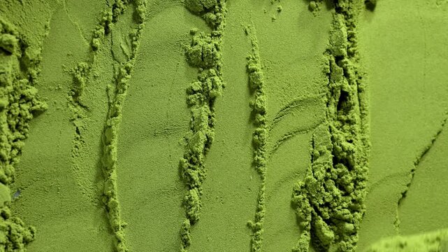 Matcha green tea powder close up, dry green powder texture, detox superfood concept, healthy lifestyle. Moringa, Spirulina, chlorella superfoods