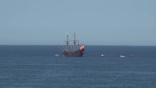 Historic Galleon with Spanish flag sailing close to the coast of Ireland in County Donegal