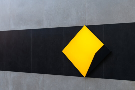 Adelaide, South Australia - January 2, 2022: Commonwealth Bank of Australia branch logo on the wall next to the entrance in Adelaide Chinatown, viewed from Moonta street