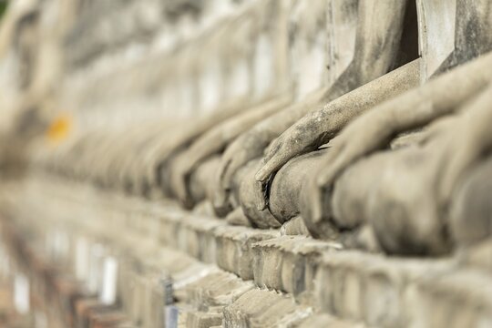 Row of Buddha statues (Bhumispara-mudra, Buddha Gautama at the moment of enlightenment), Great Chedi Chaya Mongkol, Wat Yai Chai Mongkon, Ayutthaya, Thailand
