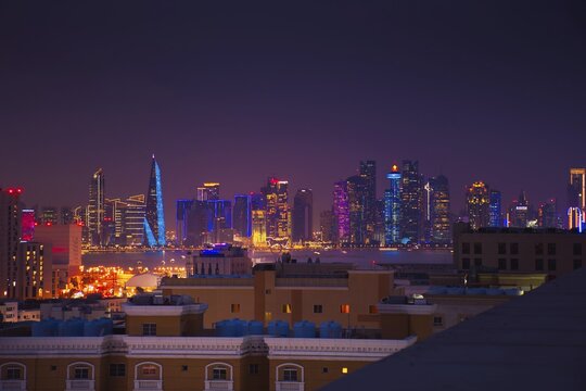 Doha, Qatar - january 8th, 2026: residential area and Doha business hub skyline at night. Iconic illuminated skyscrapers business district luxury middle east gulf colorful night architecture