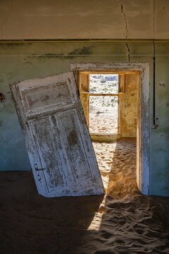 Interior view, doors and house full of sand, former diamond mining town, Namib Desert, Kolmanskop, Karas, Namibia