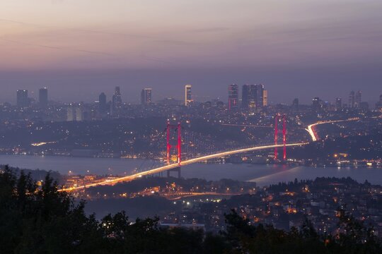 View from Camlica hill to 15 July Martyrs bridge with scyscrapers in the backgroun.d during the blue hour.Romantic Istanbul. Turkey