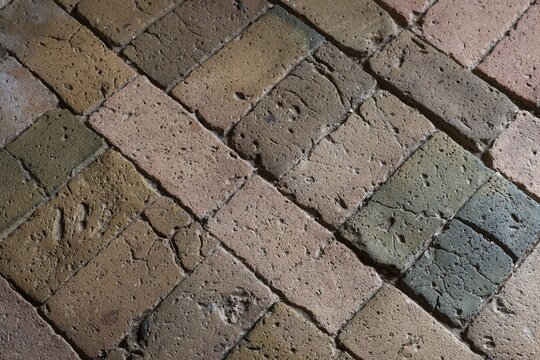 Detailed view, floor with old earth-colored bricks crisscrossed by cracks, church, Husby Church, Husby, Holstebro Municipality, Denmark