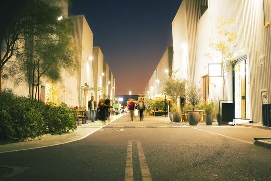 Dubai, UAE - 16th january, 2026: Alserkal Avenue at night in Al Quoz. Visitors visit Industrial galleries, shops, cafes and creative hubs illuminated under festive string lights