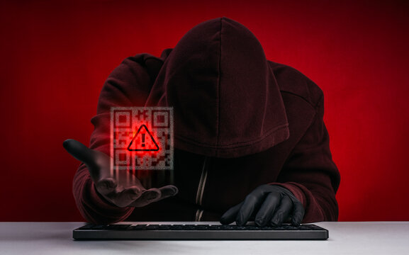 Cybercriminal scammer using malicious QR code for quishing attack, phishing scam, fake payment fraud, credential theft, mobile security threats, cybersecurity awareness, and digital fraud prevention.