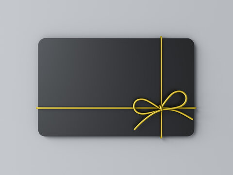 Blank black business gift card mock up with gold rope bow isolated on gray background with shadow minimal conceptual 3D rendering