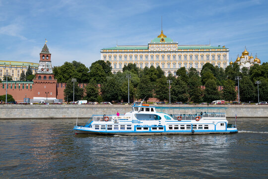 MOSCOW, RUSSIA - JULY 20, 2026: Retro motor ship "Alina Tango" on the background of the Grand Kremlin Palace on a sunny July day. Moscow