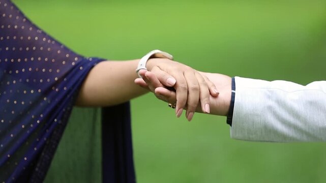 man and woman hands, couple hands, hands together, romantic touch, love gesture, holding hands, interlocked fingers, gentle grip, wedding rings, couple bonding, intimate moment, close up, no face, 