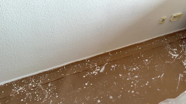 Protective paper on the floor during room painting job