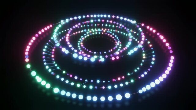 虹色の光の粒が渦を描くリング群