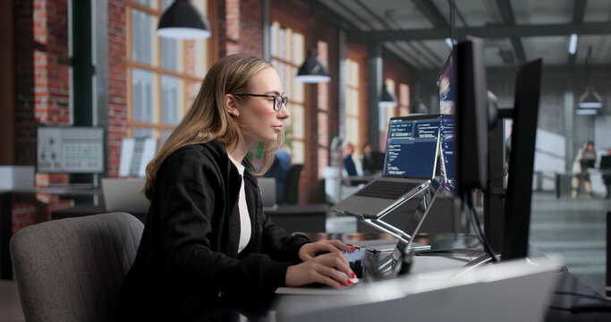 Young Female Software Engineer Working On Secure Coding
