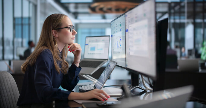Woman Payroll Specialist Uses Laptop