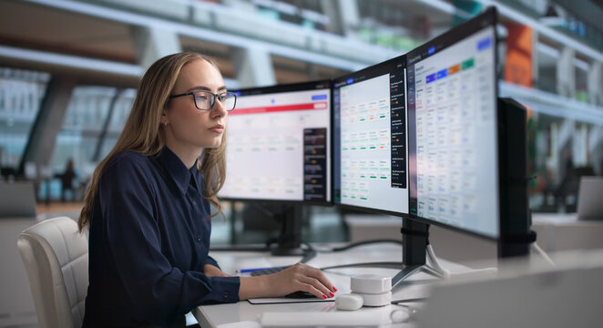 Young Woman Monitors Real-time Business Dashboard Tracking Data Risks