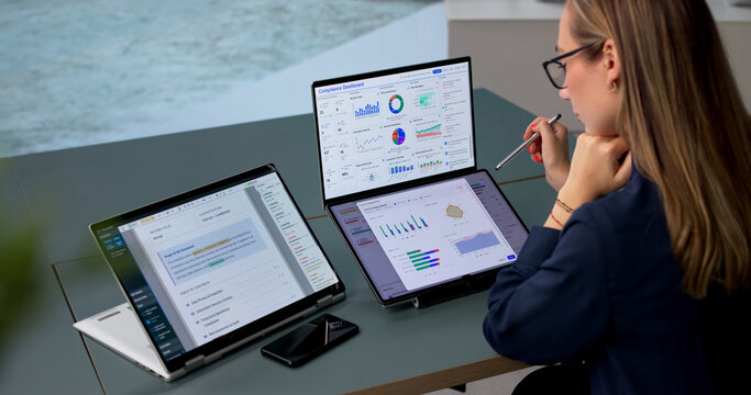 Young Woman Uses Dual Touchscreen Laptop