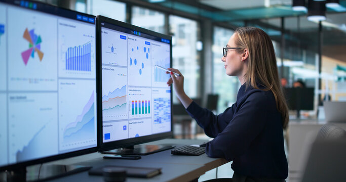 Young Female Financial Analyst Reviewing Market Data