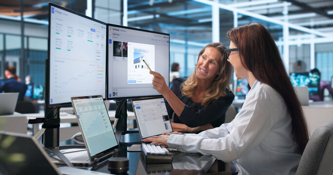 Woman Analyzes Marketing Data On Laptop