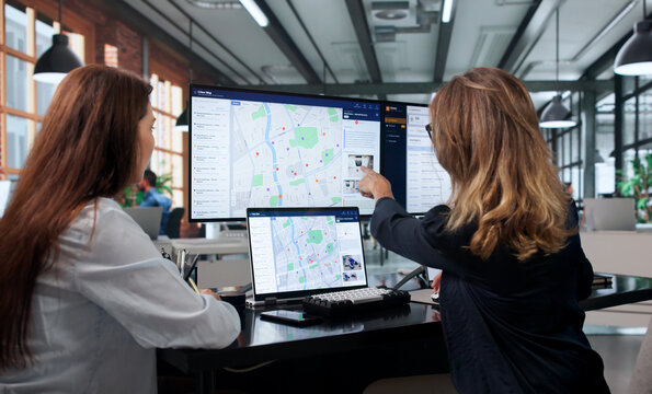 Woman Studies Police Data On Laptop