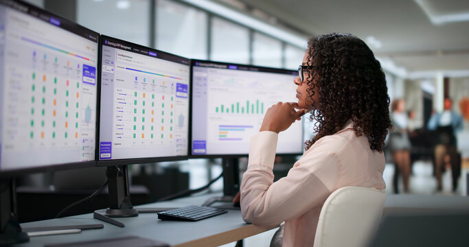 Woman Procurement Manager Analyzes Supplier Bids On Computer