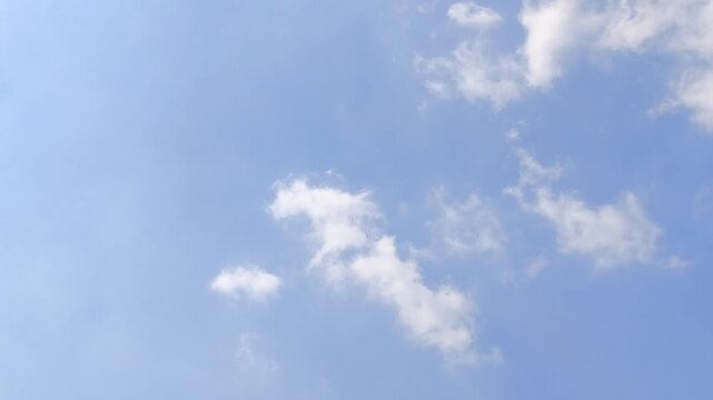 Blue Sky with Soft White Clouds Background