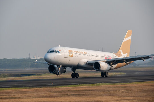 Jakarta, Indonesia - July 15, 2026: Close-up of the nose and cockpit of a Super Air Jet Airbus A320 during landing at Soekarno-Hatta International Airport.	