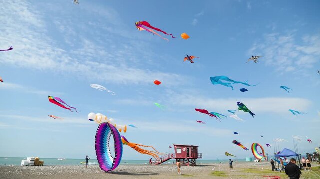 Colorful kite festival with vibrant kites soaring across the sky
