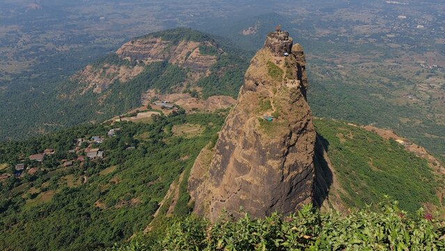 Kalavantin Durg pinnacle with trekkers climbing steep steps near Prabalgad Maharashtra India