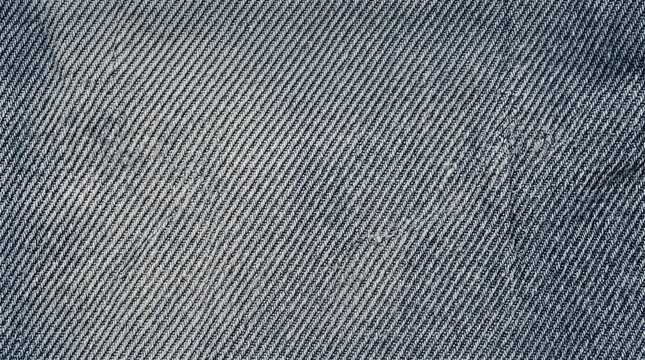 Faded bluish-gray neutral washed denim canvas displaying detailed diagonal twill weave, photorealistic macro photography creates commercial stock material.