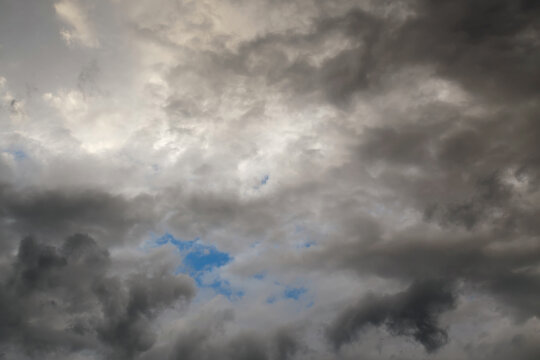Stormy sky with a blue gap