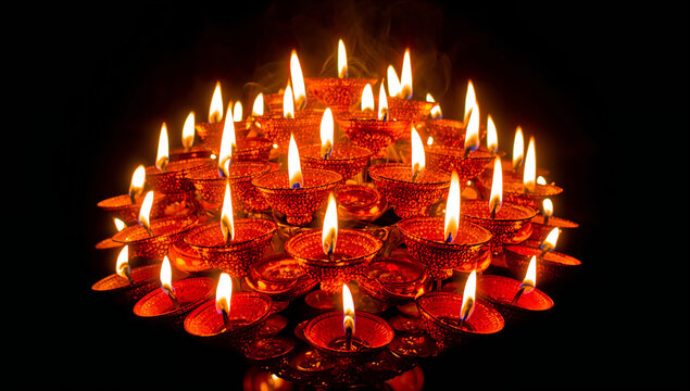 Many traditional burning oil lamps arranged on dark background with festival deepavali religion tradition ceremony hinduism darkness spiritual cultural celebration blessing offering