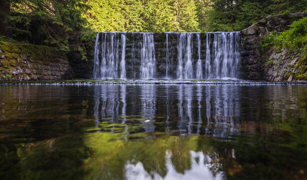Beautiful water dam with a reflection in Giant Mine valley, Krkonose Mountains, Czech Republic