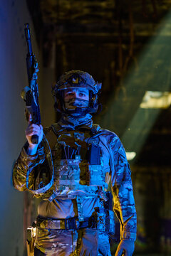 Armed Soldier in Tactical Gear Holding Rifle Under Dramatic Light in Urban Military Scene