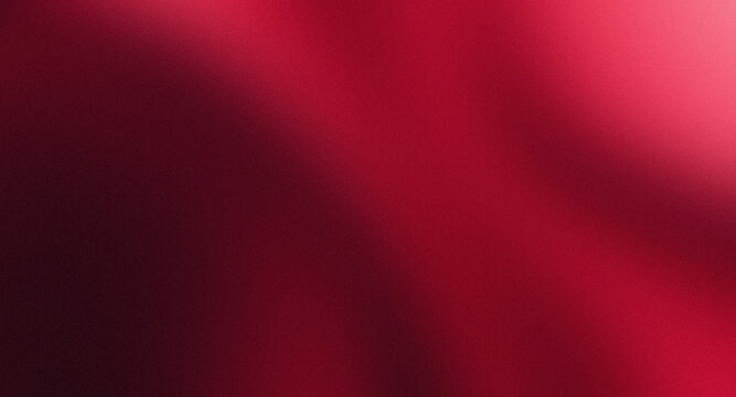 abstract red background with soft blending of burgundy, crimson, pink gradients, and the surface is enriched with a fine grain texture