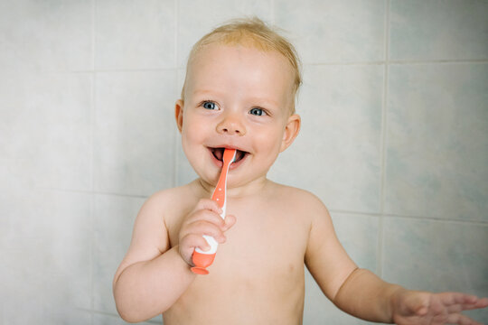 Baby brushing his teeth