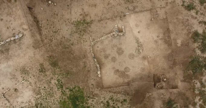 Drone top view of archaeological excavations at the ancient "Wild Park" settlement in Mykolaiv, Ukraine, revealing stone foundations and excavation trenches