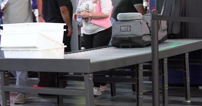 Checking luggage and passengers before entering the train station. Safety and security