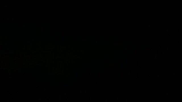 Lightning thunderstorm flash over the night dark sky on the horizon. Concept on topic weather, cataclysms.
