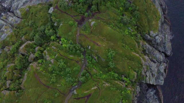 Scenic sunset aerial of Husoy island with mountains and fjord in Northern Norway